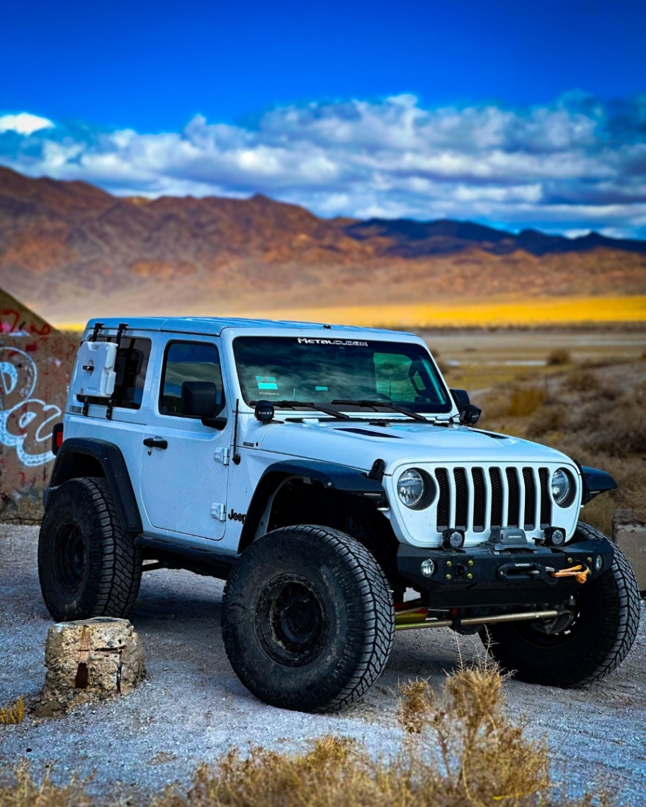 Storm, a white 2021 Jeep Wrangler, photo 10 of 12
