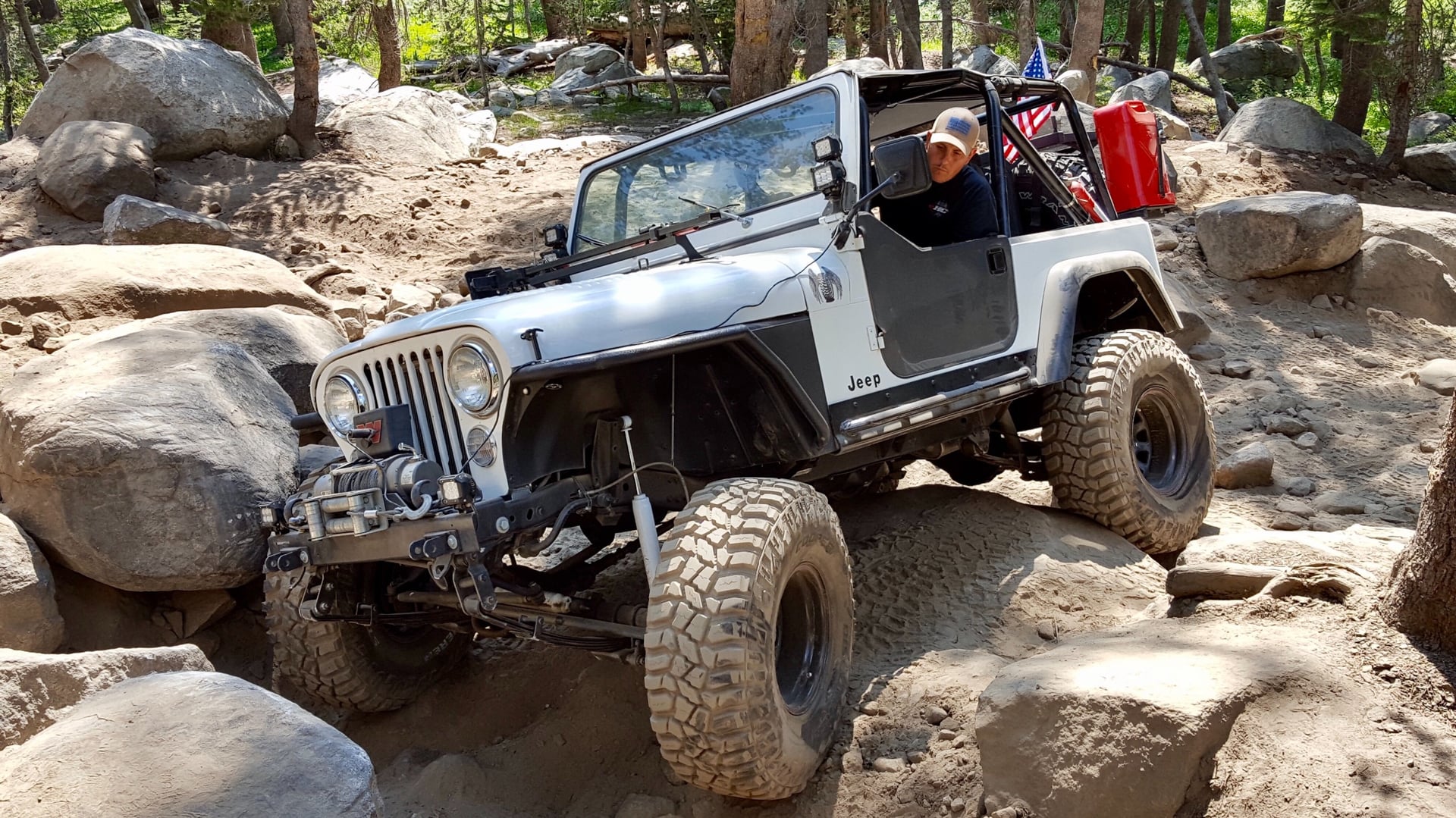RNIN WLD, a blue 1984 Jeep CJ-7 on 35-inch tires with a 4.5-inch lift, photo 13 of 19