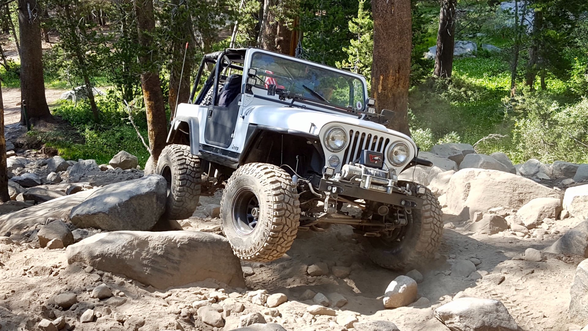 RNIN WLD, a blue 1984 Jeep CJ-7 on 35-inch tires with a 4.5-inch lift, photo 16 of 19