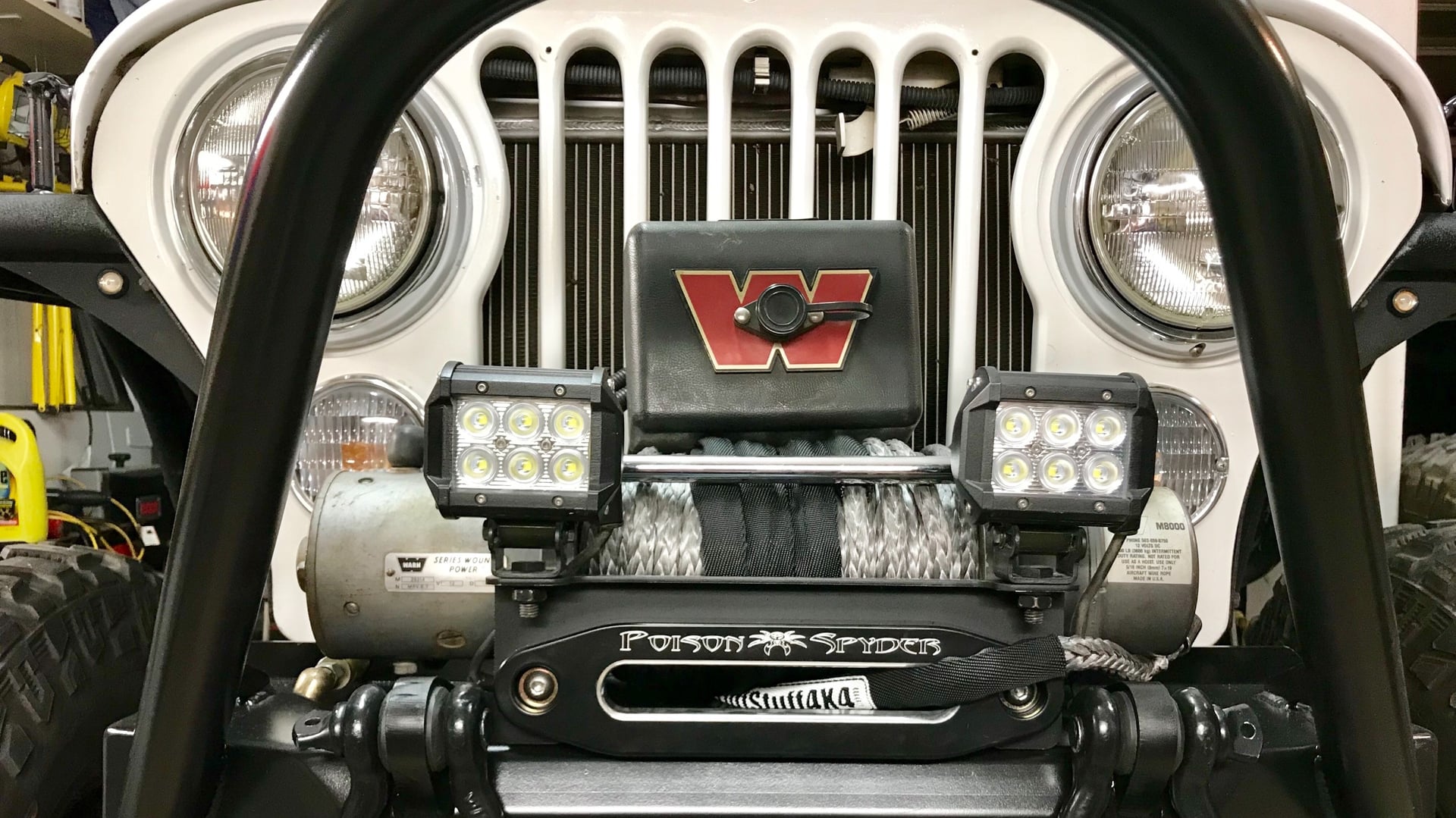 RNIN WLD, a blue 1984 Jeep CJ-7 on 35-inch tires with a 4.5-inch lift, photo 18 of 19
