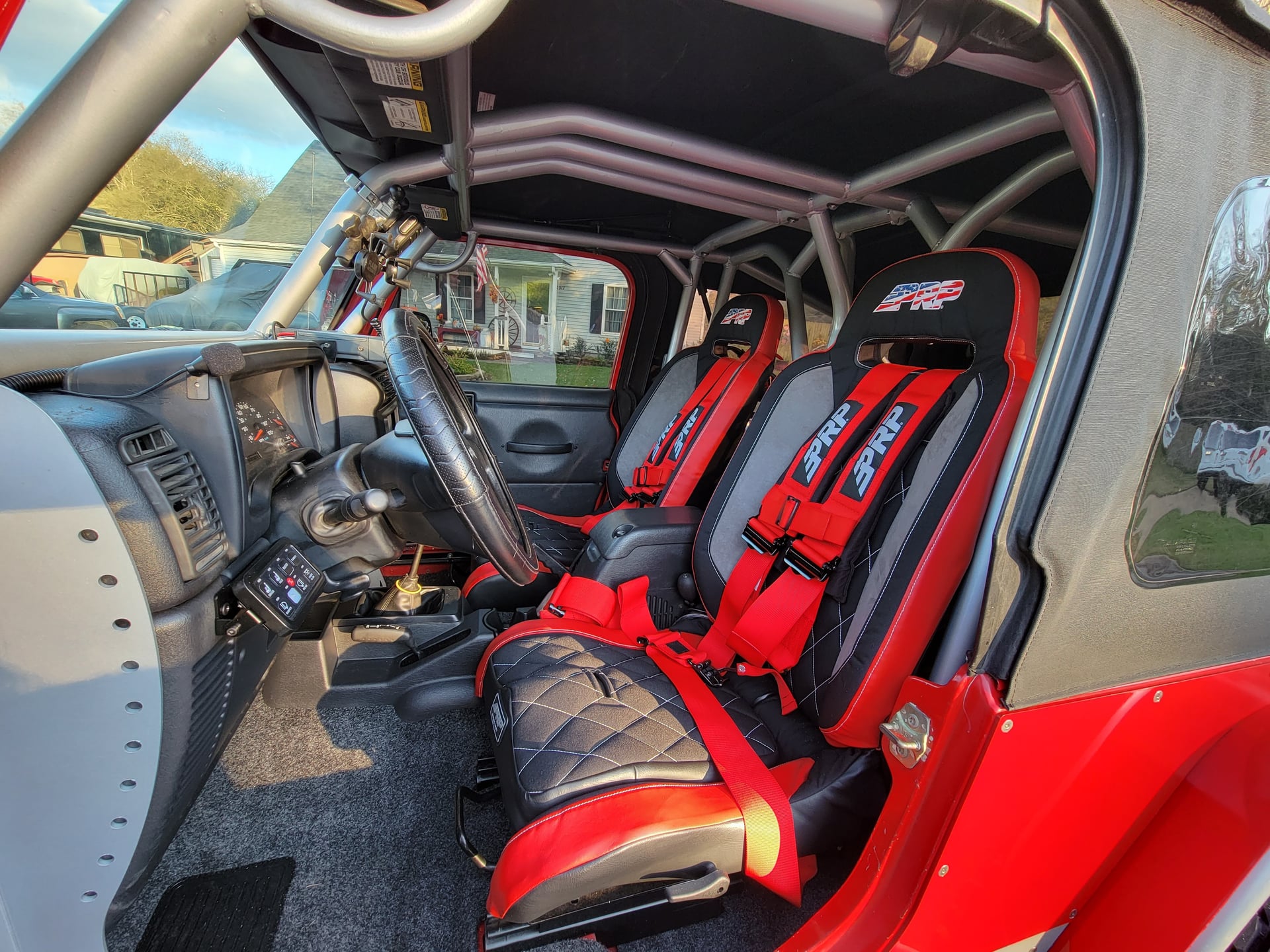 SilverLining, a red 2006 Jeep Wrangler LJ, photo 10 of 12