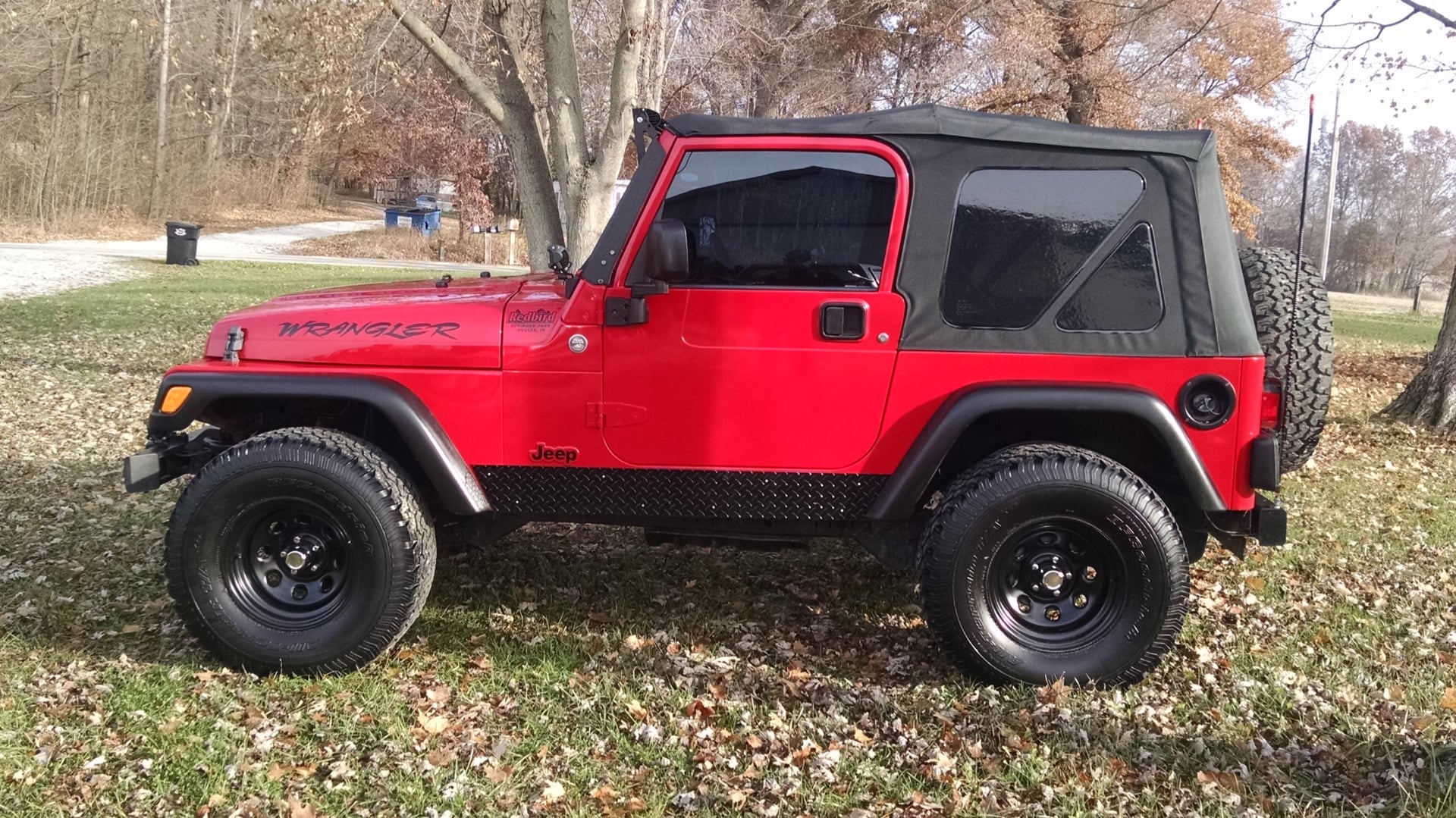 Red Rangler, a red 2006 Jeep Wrangler TJ on 33-inch tires with a 2.5-inch lift, photo 12 of 26
