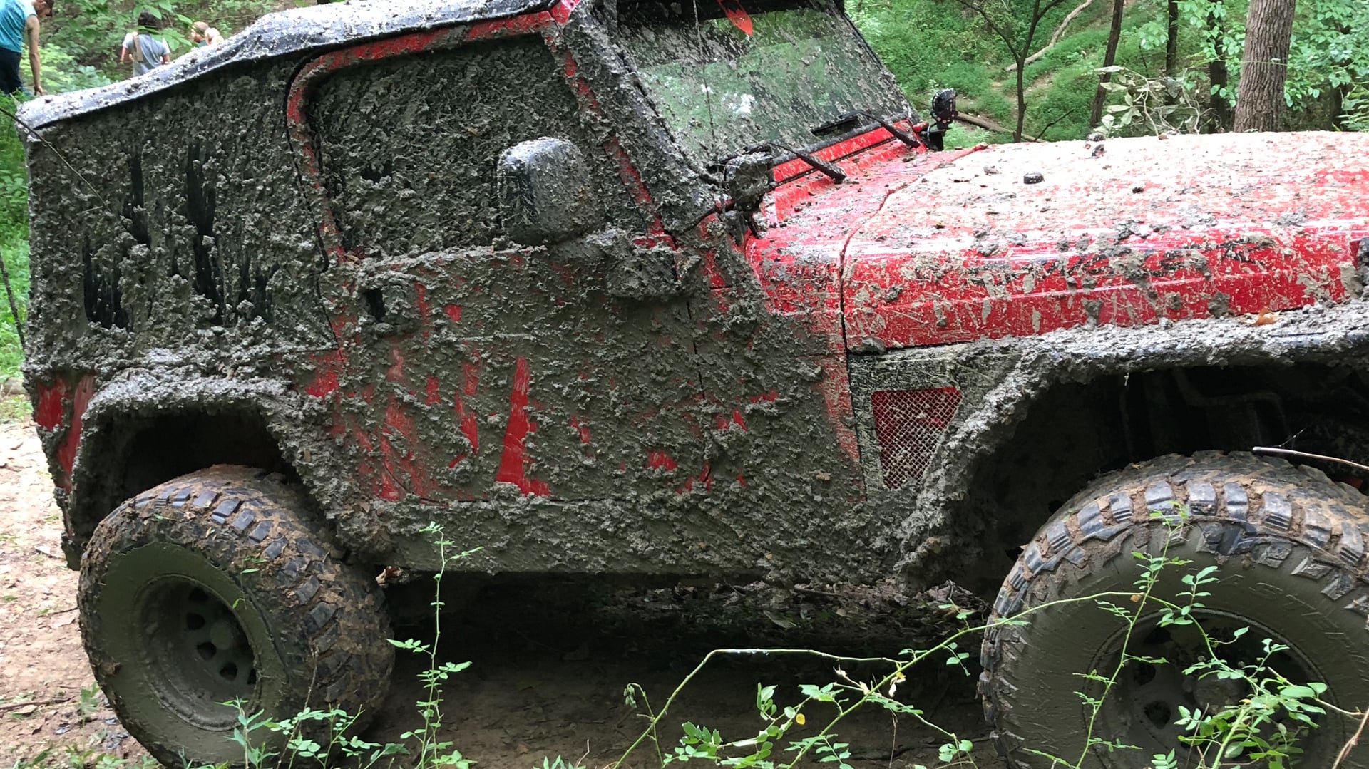 Red Rangler, a red 2006 Jeep Wrangler TJ on 33-inch tires with a 2.5-inch lift, photo 13 of 26