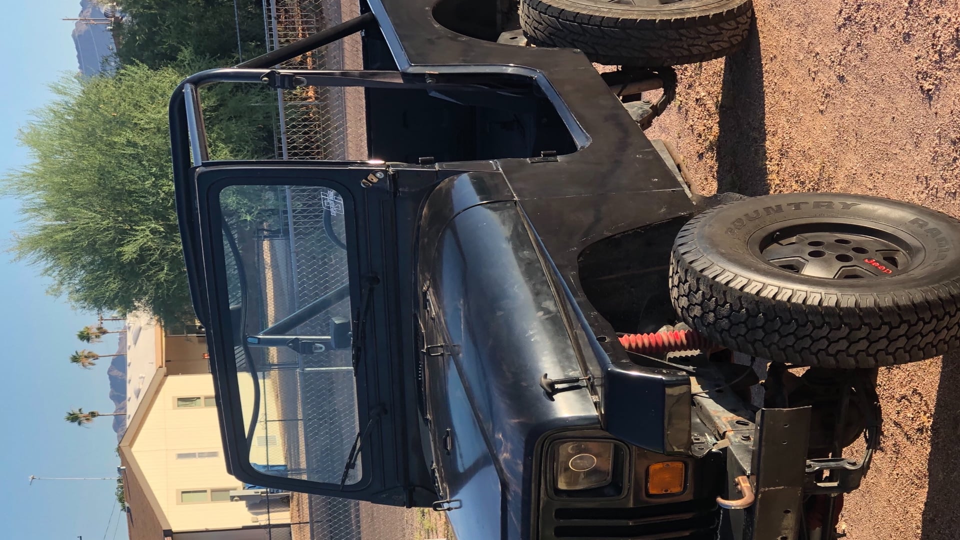 Shadow, a black 1988 Jeep Wrangler YJ with a 4.5-inch lift, photo 15 of 23