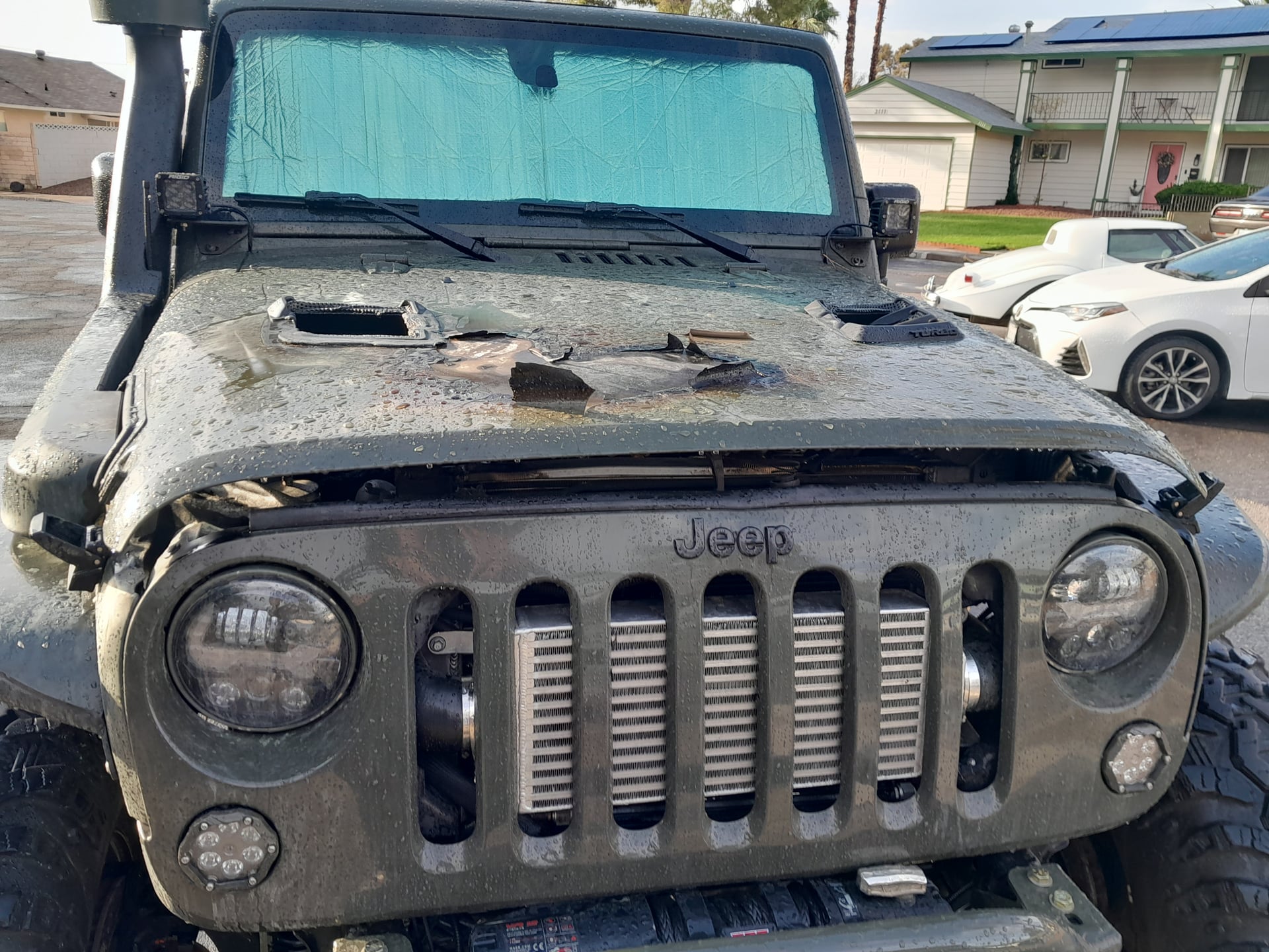 Julio The Tank Rubicon, a tan 2015 Jeep Wrangler JKU on 39.5-inch tires with a 4.5-inch lift, photo 26 of 27