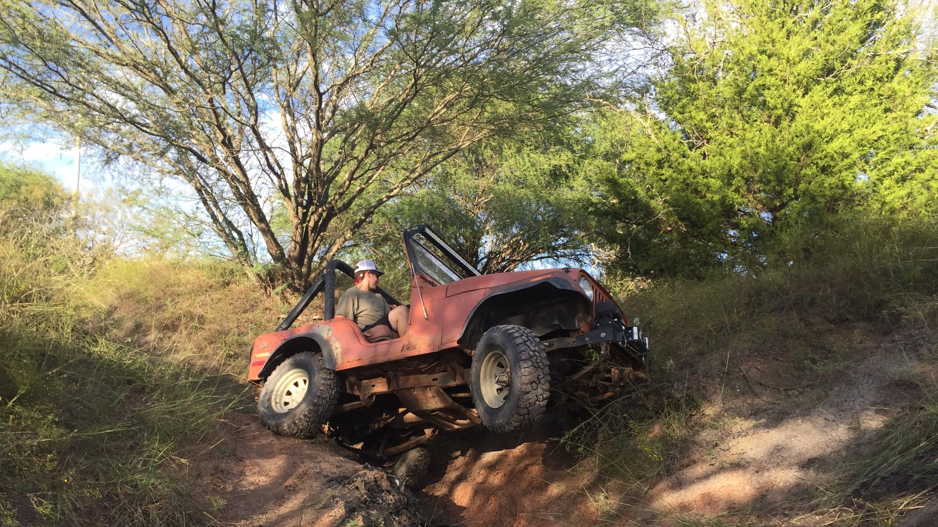 Aggie CJ5, a green 1976 Jeep CJ-5 on 37-inch tires, photo 11 of 12