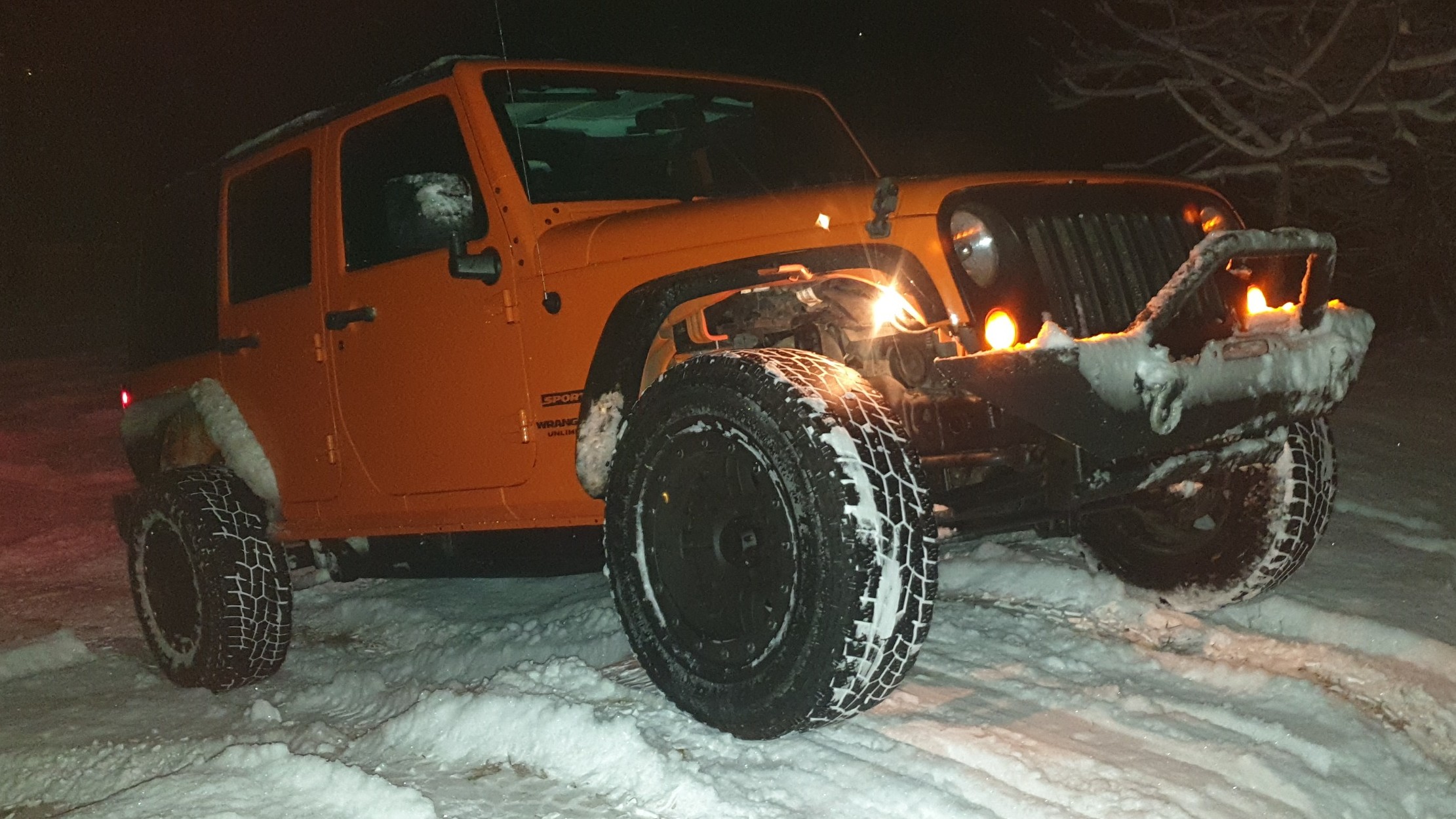 Krawler Of Christ, an orange 2012 Jeep Wrangler JKU on 38-inch tires with a 3.5-inch lift, photo 28 of 30