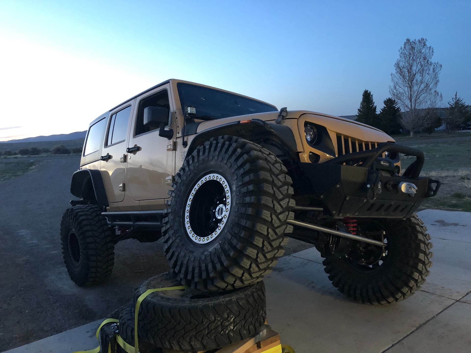 Sully's 1 Ton JKU, a tan 2014 Jeep Wrangler JKU on 40-inch tires, photo 10 of 12