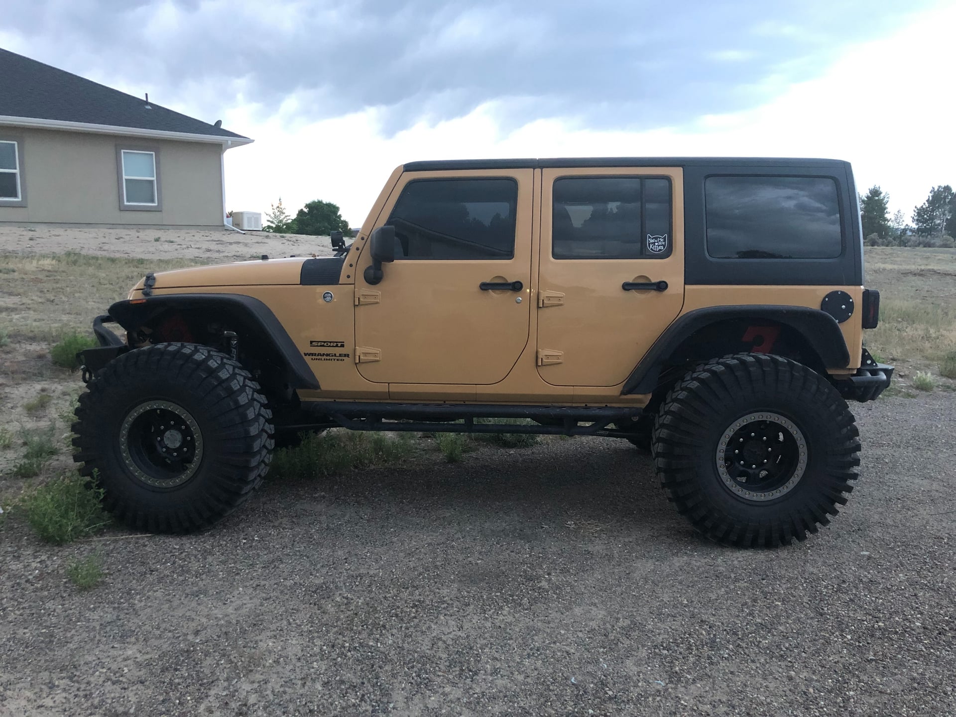 Sully's 1 Ton JKU, a tan 2014 Jeep Wrangler JKU on 40-inch tires, photo 11 of 12