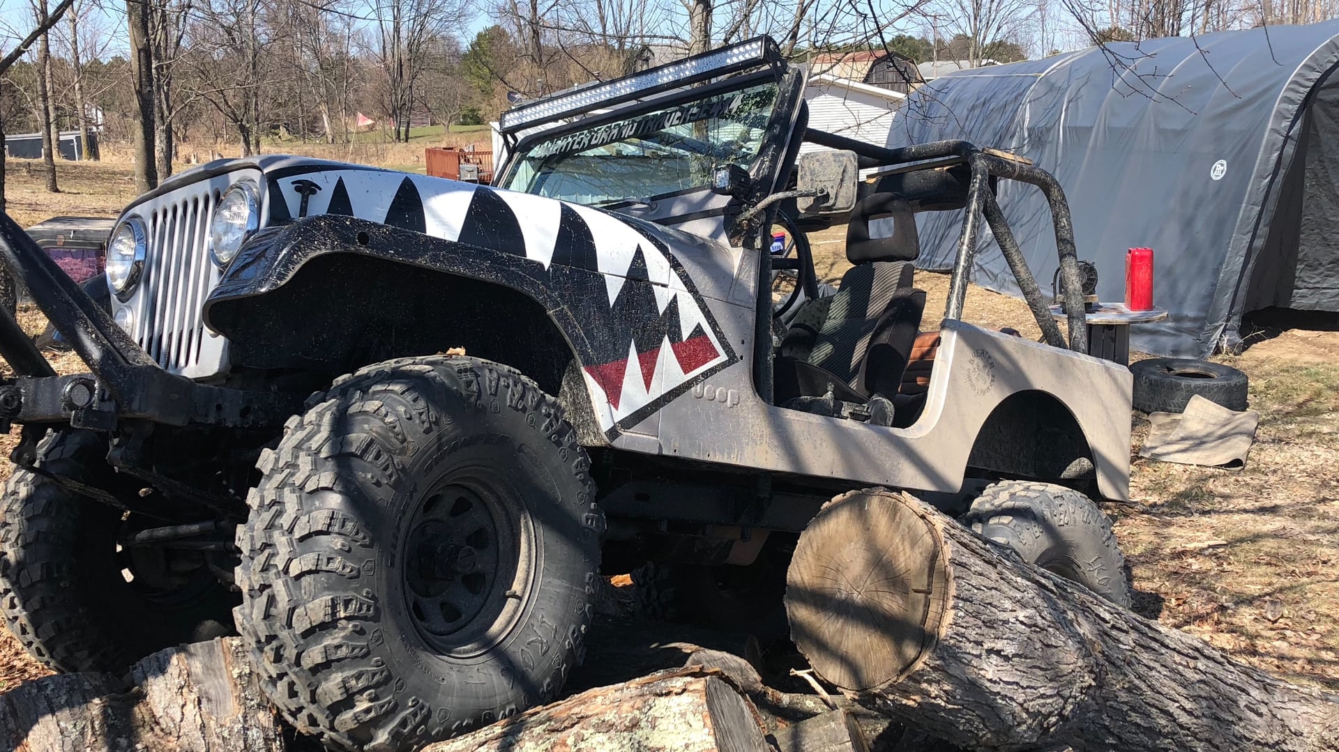 Miss Behavin’, a multi-color 1983 Jeep CJ-7 on 42-inch tires, photo 19 of 31