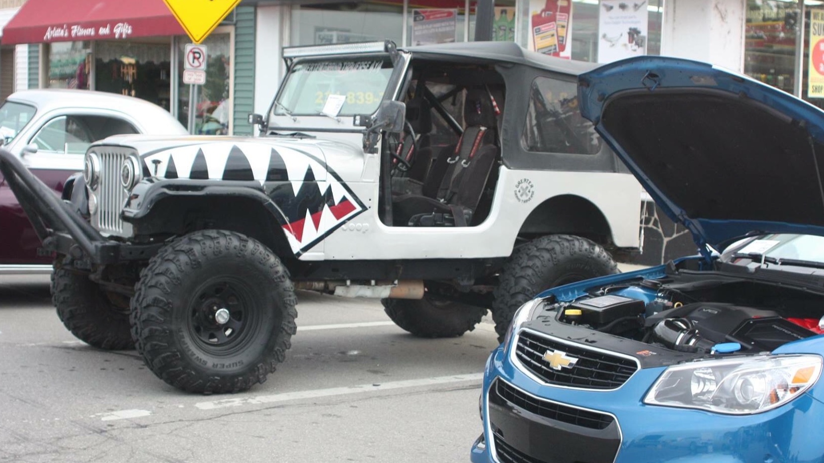 Miss Behavin’, a multi-color 1983 Jeep CJ-7 on 42-inch tires, photo 26 of 31