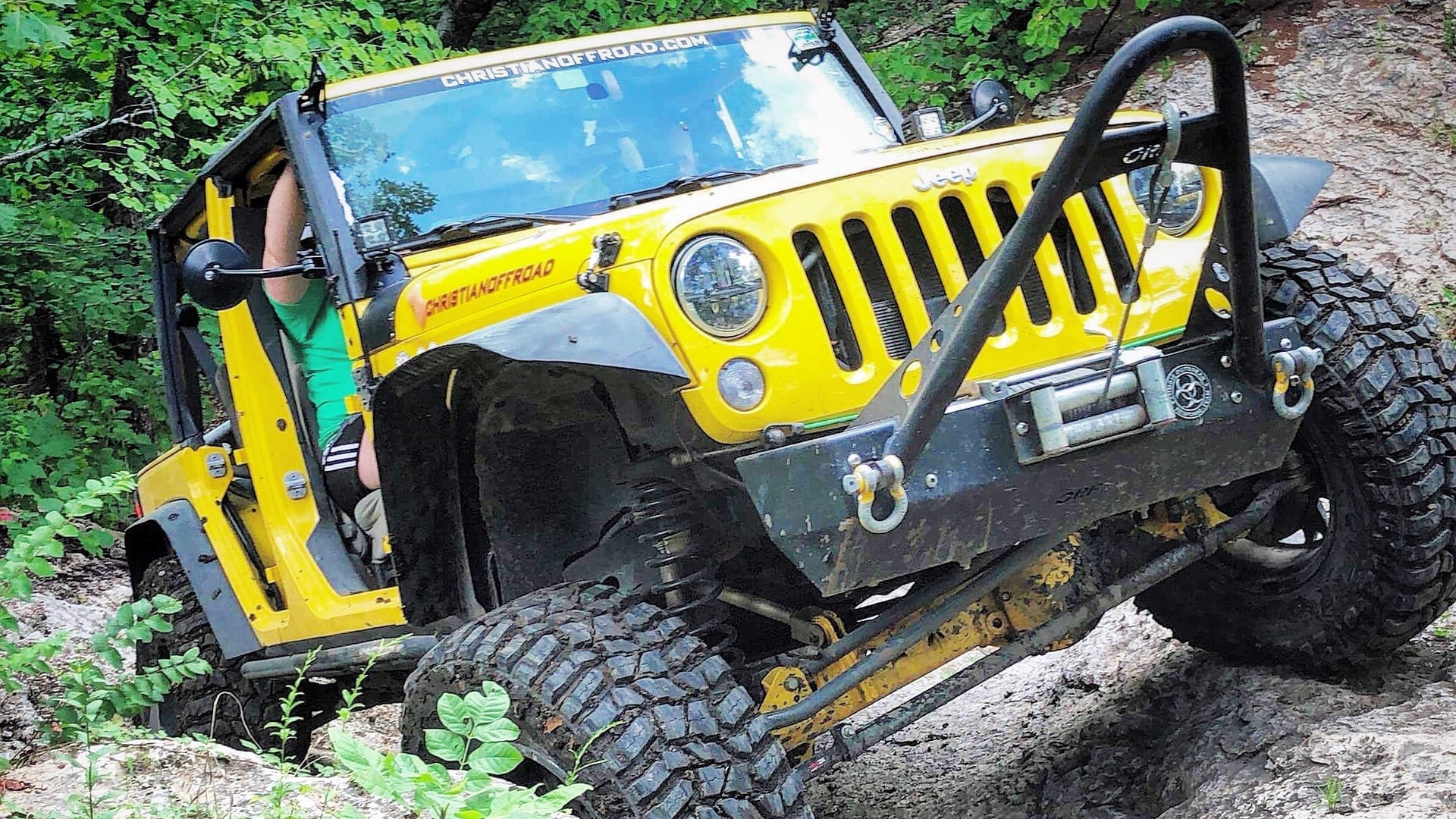 Yellow, a yellow 2009 Jeep Wrangler JKU on 37-inch tires, photo 12 of 12