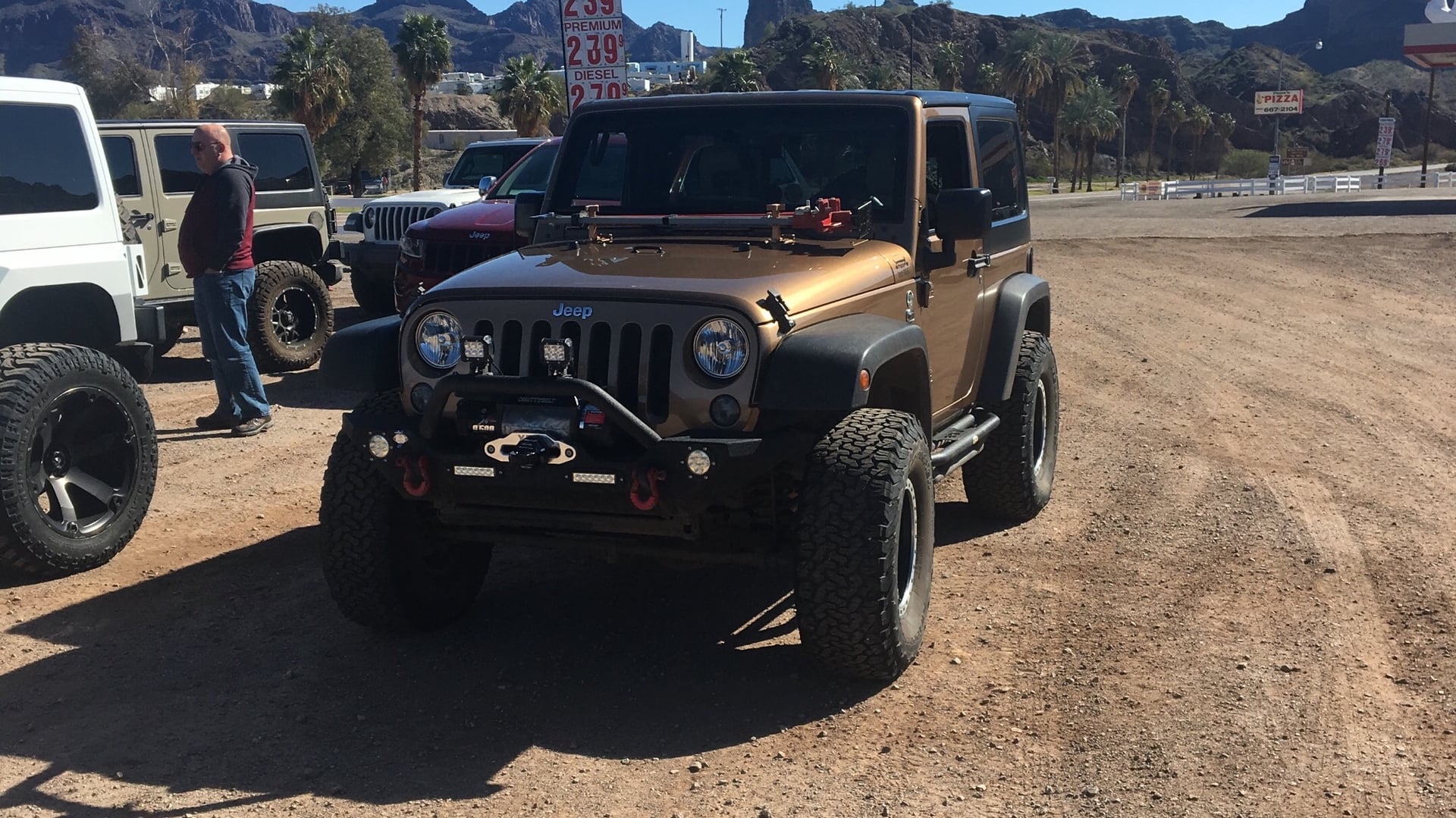 Penny AKA 401-K, a tan 2015 Jeep Wrangler JK on 35-inch tires with a 3-inch lift, photo 12 of 17